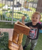 Child is very happy while playing in Little Scholar Academy